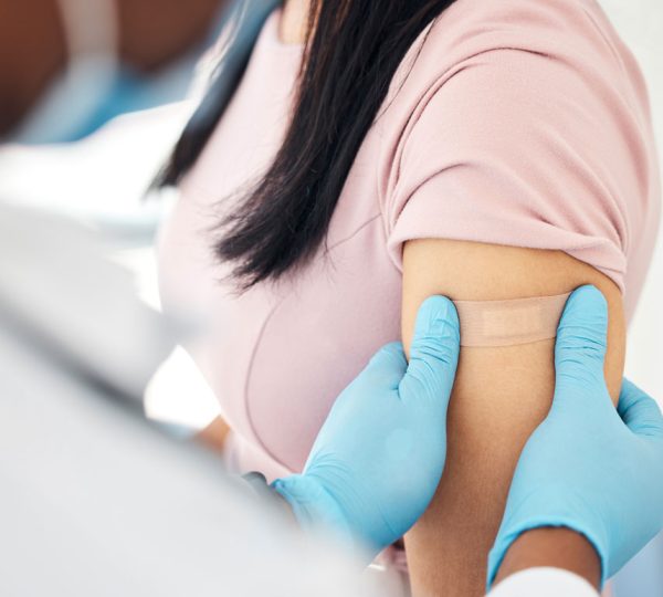 covid-vaccine-and-bandaid-with-hands-of-doctor-an-2022-12-22-20-00-35-utc